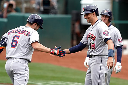 Apr 4, 2021; Oakland, California, USA; Houston Astros left fielder Chas McCormick (6) receives congratulations from catcher Jason Castro (18) after hitting a home run during the sixth inning against the Oakland Athletics at RingCentral Coliseum. Mandatory Credit: Darren Yamashita-USA TODAY Sports