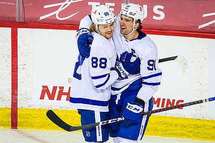 Apr 4, 2021; Calgary, Alberta, CAN; Toronto Maple Leafs center John Tavares (91) celebrates his goal with center William Nylander (88) during the third period against the Calgary Flames at Scotiabank Saddledome. Mandatory Credit: Sergei Belski-USA TODAY Sports