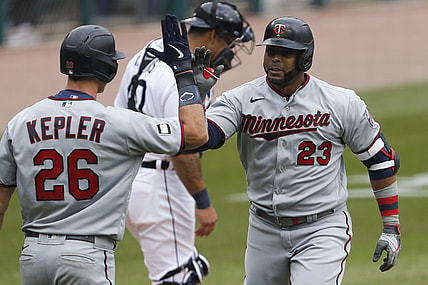 Apr 5, 2021; Detroit, Michigan, USA; Minnesota Twins designated hitter Nelson Cruz (23) celebrates with right fielder Max Kepler (26) after hitting a solo home run during the fifth inning against the Detroit Tigers at Comerica Park. Mandatory Credit: Raj Mehta-USA TODAY Sports