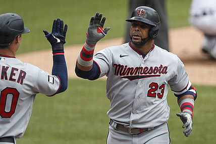 Apr 5, 2021; Detroit, Michigan, USA; Minnesota Twins designated hitter Nelson Cruz (23) celebrates with left fielder Brent Rooker (50) after hitting a solo home run during the fifth inning against the Detroit Tigers at Comerica Park. Mandatory Credit: Raj Mehta-USA TODAY Sports