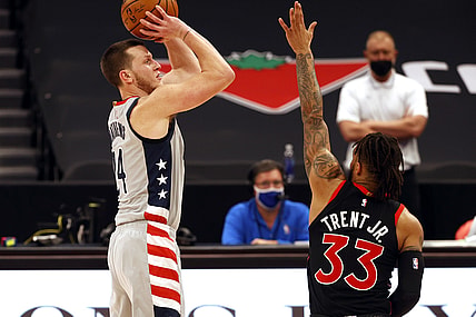 Apr 5, 2021; Tampa, Florida, USA;  Washington Wizards forward Garrison Mathews (24) shoots a three point basket over Toronto Raptors guard Gary Trent Jr. (33) during the first half at Amalie Arena. Mandatory Credit: Kim Klement-USA TODAY Sports