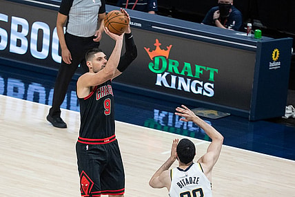 Apr 6, 2021; Indianapolis, Indiana, USA; Chicago Bulls center Nikola Vucevic (9) shoots the ball while Indiana Pacers center Goga Bitadze (88) defends in the third quarter at Bankers Life Fieldhouse. Mandatory Credit: Trevor Ruszkowski-USA TODAY Sports