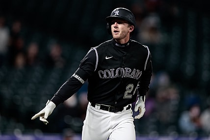 Apr 6, 2021; Denver, Colorado, USA; Colorado Rockies third baseman Ryan McMahon (24) gestures as he rounds the bases on a solo home run in the second inning against the Arizona Diamondbacks at Coors Field. Mandatory Credit: Isaiah J. Downing-USA TODAY Sports