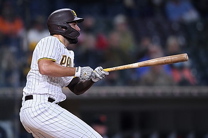 Apr 6, 2021; San Diego, California, USA; San Diego Padres first baseman Eric Hosmer (30) watches his RBI single during the third inning against the San Francisco Giants at Petco Park. Mandatory Credit: Orlando Ramirez-USA TODAY Sports
