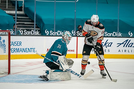 Apr 6, 2021; San Jose, California, USA;  Anaheim Ducks center Adam Henrique (14) attempt to shoot the puck against San Jose Sharks goaltender Martin Jones (31) during the first period at SAP Center at San Jose. Mandatory Credit: Neville E. Guard-USA TODAY Sports