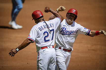 Apr 7, 2021; Arlington, Texas, USA; Texas Rangers third base coach Tony Beasley (27) and second baseman Nick Solak (15)  celebrate Solak hitting a home run against the Toronto Blue Jays  during the second inning at Globe Life Field. Mandatory Credit: Jerome Miron-USA TODAY Sports
