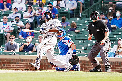 Apr 7, 2021; Chicago, Illinois, USA; Milwaukee Brewers center fielder Lorenzo Cain (6) hits a home run against the Chicago Cubs during the eighth inning  at Wrigley Field. Mandatory Credit: David Banks-USA TODAY Sports