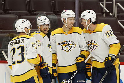 Apr 8, 2021; Detroit, Michigan, USA;  Nashville Predators right wing Viktor Arvidsson (33) is congratulated by teammates after scoring in the third period against the Detroit Red Wings at Little Caesars Arena. Mandatory Credit: Rick Osentoski-USA TODAY Sports