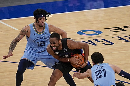 Apr 9, 2021; New York, New York, USA; New York Knicks guard Alec Burks (18) drives against Memphis Grizzlies forward Brandon Clarke (15) and guard Tyus Jones (21) in the first half at Madison Square Garden. Mandatory Credit: Mary Altaffer-Pool Photo via USA TODAY Sports