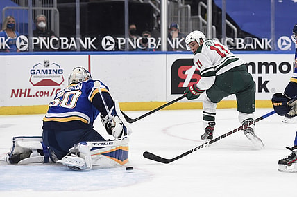 Apr 9, 2021; St. Louis, Missouri, USA; Minnesota Wild left wing Zach Parise (11) takes a shot on St. Louis Blues goaltender Jordan Binnington (50) in the first period at Enterprise Center. Mandatory Credit: Joe Puetz-USA TODAY Sports
