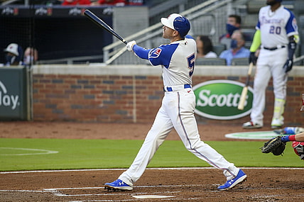 Apr 10, 2021; Atlanta, Georgia, USA; Atlanta Braves first baseman Freddie Freeman (5) hits a two run home run against the Philadelphia Phillies in the first inning at Truist Park. Mandatory Credit: Brett Davis-USA TODAY Sports