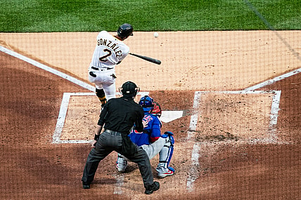 Apr 10, 2021; Pittsburgh, Pennsylvania, USA; Pittsburgh Pirates second baseman Erik Gonzalez (2) hits an RBI double against the Chicago Cubs at PNC Park. Mandatory Credit: Mark Alberti-USA TODAY Sports