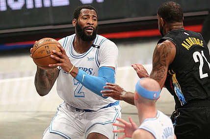 Apr 10, 2021; Brooklyn, New York, USA; Los Angeles Lakers center Andre Drummond (2) drives to the basket against Brooklyn Nets center LaMarcus Aldridge (21) during the third quarter at Barclays Center. Mandatory Credit: Brad Penner-USA TODAY Sports