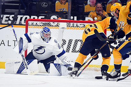 Apr 10, 2021; Nashville, Tennessee, USA; Tampa Bay Lightning goaltender Andrei Vasilevskiy (88) makes a save on a shot by Nashville Predators center Mikael Granlund (64) during the second period at Bridgestone Arena. Mandatory Credit: Christopher Hanewinckel-USA TODAY Sports