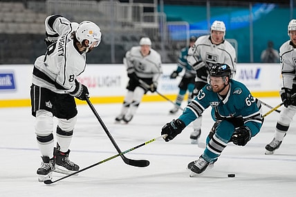 Apr 10, 2021; San Jose, California, USA;  San Jose Sharks left wing Jeffrey Truchon-Viel (63) defends against Los Angeles Kings defenseman Drew Doughty (8) during the first periodat SAP Center at San Jose. Mandatory Credit: Stan Szeto-USA TODAY Sports