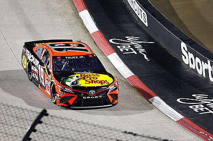 Apr 10, 2021; Martinsville, Virginia, USA; NASCAR Cup Series driver Martin Truex Jr. (19) races at the Blue-Emu Maximum Pain Relief 500 at Martinsville Speedway. Mandatory Credit: Ryan Hunt-USA TODAY Sports