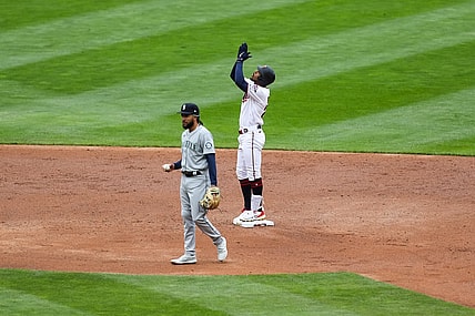 Apr 11, 2021; Minneapolis, Minnesota, USA; Minnesota Twins center fielder Byron Buxton (25) celebrates after hitting an RBI double in the third inning while Seattle Mariners shortstop J.P. Crawford (3) looks on at Target Field. Mandatory Credit: David Berding-USA TODAY Sports