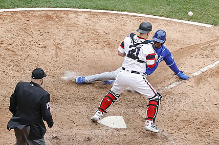 Apr 11, 2021; Chicago, Illinois, USA; Kansas City Royals center fielder Michael A. Taylor (2) scores as Chicago White Sox catcher Zack Collins (21) is unable to tag him out during the tenth inning at Guaranteed Rate Field. Mandatory Credit: Kamil Krzaczynski-USA TODAY Sports