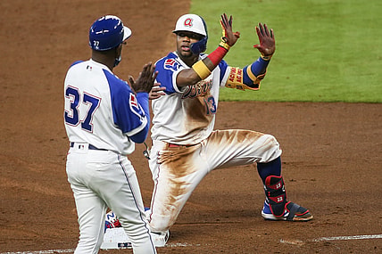 Apr 12, 2021; Atlanta, Georgia, USA; Atlanta Braves right fielder Ronald Acuna Jr. (13) asks for time out in front of third base coach Ron Washington (37) after a triple against the Miami Marlins in the third inning at Truist Park. Mandatory Credit: Brett Davis-USA TODAY Sports