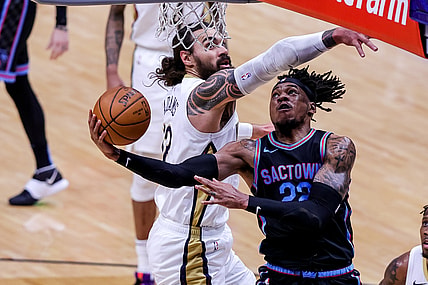 Apr 12, 2021; New Orleans, Louisiana, USA; New Orleans Pelicans center Steven Adams (12) defends the basket against Sacramento Kings center Richaun Holmes (22) during the first half at Smoothie King Center. Mandatory Credit: Stephen Lew-USA TODAY Sports