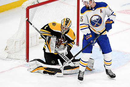 Apr 13, 2021; Boston, Massachusetts, USA; Boston Bruins goaltender Jeremy Swayman (1) makes a save in front of Buffalo Sabres defenseman Rasmus Ristolainen (55) during the first period at TD Garden. Mandatory Credit: Brian Fluharty-USA TODAY Sports