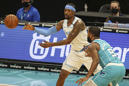 Apr 13, 2021; Charlotte, North Carolina, USA; Los Angeles Lakers guard Kentavious Caldwell-Pope (1) passes away from Charlotte Hornets guard Brad Wanamaker (9) during the first quarter at Spectrum Center. Mandatory Credit: Nell Redmond-USA TODAY Sports