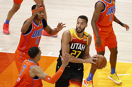 Apr 13, 2021; Salt Lake City, Utah, USA;  Utah Jazz center Rudy Gobert (27) looks to pass against Oklahoma City Thunder forward Darius Bazley (7) and center Moses Brown (9) in the first quarter at Vivint Smart Home Arena. Mandatory Credit: Jeffrey Swinger-USA TODAY Sports