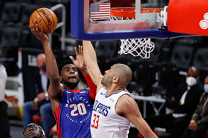Apr 14, 2021; Detroit, Michigan, USA;  Detroit Pistons guard Josh Jackson (20) goes to the basket on LA Clippers forward Nicolas Batum (33) in the first half at Little Caesars Arena. Mandatory Credit: Rick Osentoski-USA TODAY Sports