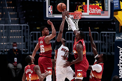 Apr 14, 2021; Denver, Colorado, USA; Denver Nuggets forward Paul Millsap (4) blocks the shot of Miami Heat center Bam Adebayo (13) as guard PJ Dozier (35) and forward Will Barton (5) forward JaMychal Green (0) defend in the second quarter at Ball Arena. Mandatory Credit: Isaiah J. Downing-USA TODAY Sports