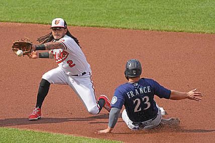 Apr 15, 2021; Baltimore, Maryland, USA; Seattle Mariners second baseman Ty France (23) slides into second base ahead of the throw to Baltimore Orioles shortstop Freddy Galvis (3) in the second inning at Oriole Park at Camden Yards. Mandatory Credit: Mitch Stringer-USA TODAY Sports