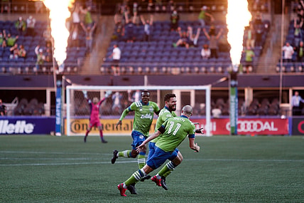 Apr 16, 2021; Seattle, Washington, USA; Seattle Sounders FC teammates celebrate a goal by midfielder Joao Paulo (6) against the Minnesota United FC during the second half at Lumen Field. Mandatory Credit: Jennifer Buchanan-USA TODAY Sports