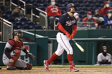 Apr 16, 2021; Washington, District of Columbia, USA; Washington Nationals left fielder Kyle Schwarber (12) hits a walk-off home run against the Arizona Diamondbacks in the ninth inning at Nationals Park. Mandatory Credit: Geoff Burke-USA TODAY Sports