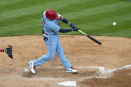 Apr 17, 2021; Philadelphia, Pennsylvania, USA; St. Louis Cardinals catcher Yadier Molina (4) hits a home run during the fourth inning against the Philadelphia Phillies at Citizens Bank Park. Mandatory Credit: Gregory Fisher-USA TODAY Sports