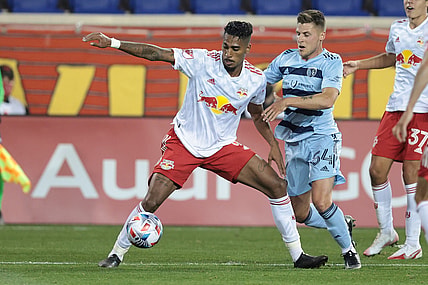 Apr 17, 2021; Harrison, New Jersey, USA; New York Red Bulls forward Fabio (9) plays the ball against Sporting Kansas City midfielder Remi Walker (54) during the first half at Red Bull Arena. Mandatory Credit: Vincent Carchietta-USA TODAY Sports