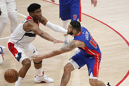 Apr 17, 2021; Washington, District of Columbia, USA; Detroit Pistons guard Cory Joseph (18) passes the ball around Washington Wizards forward Rui Hachimura (8) during the second half at Capital One Arena. Mandatory Credit: Amber Searls-USA TODAY Sports