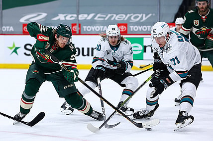 Apr 17, 2021; Saint Paul, Minnesota, USA; Minnesota Wild defenseman Jonas Brodin (25) attempts to shoot the puck as San Jose Sharks defenseman Nikolai Knyzhov (71) defends him during the second period at Xcel Energy Center. Mandatory Credit: Harrison Barden-USA TODAY Sports