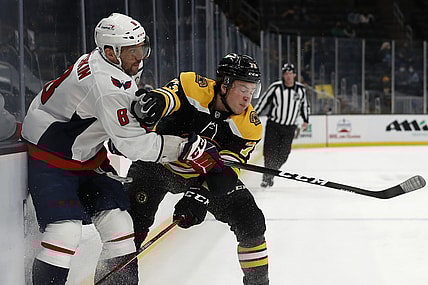 Apr 18, 2021; Boston, Massachusetts, USA; Boston Bruins defenseman Charlie McAvoy (73) collides with Washington Capitals left wing Alex Ovechkin (8) during the first period at TD Garden. Mandatory Credit: Winslow Townson-USA TODAY Sports