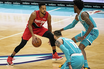 Apr 18, 2021; Charlotte, North Carolina, USA; Portland Trail Blazers guard CJ McCollum (3) brings the ball upourt defended by Charlotte Hornets forward Jalen McDaniels (6) during the first quarter at the Spectrum Center. Mandatory Credit: Jim Dedmon-USA TODAY Sports