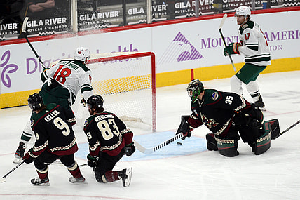 Apr 19, 2021; Glendale, Arizona, USA; Minnesota Wild left wing Jordan Greenway (18) scores a goal against Arizona Coyotes goaltender Darcy Kuemper (35) during the second period at Gila River Arena. Mandatory Credit: Joe Camporeale-USA TODAY Sports
