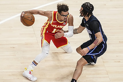 Apr 20, 2021; Atlanta, Georgia, USA; Atlanta Hawks guard Trae Young (11) dribbles against Orlando Magic guard Cole Anthony (50) during the first quarter at State Farm Arena. Mandatory Credit: Dale Zanine-USA TODAY Sports