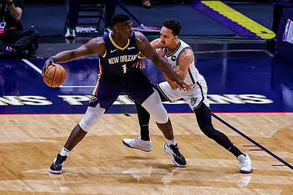 Apr 20, 2021; New Orleans, Louisiana, USA; New Orleans Pelicans forward Zion Williamson (1) looks to pass the ball against Brooklyn Nets guard Landry Shamet (20) during the first half at the Smoothie King Center. Mandatory Credit: Stephen Lew-USA TODAY Sports
