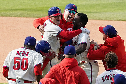 vApr 21, 2021; Philadelphia, Pennsylvania, USA; Philadelphia Phillies catcher Andrew Knapp (5) celebrates with teammates after hitting a walk off game winning RBI single during the ninth inning against the San Francisco Giants at Citizens Bank Park. Mandatory Credit: Bill Streicher-USA TODAY Sports
