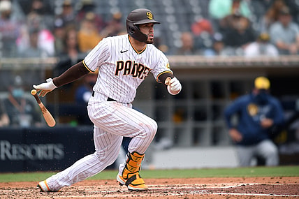 Apr 21, 2021; San Diego, California, USA; San Diego Padres catcher Victor Caratini (17) scores right fielder Jurickson Profar (not pictured) on a ground out during the fourth inning against the Milwaukee Brewers at Petco Park. Mandatory Credit: Orlando Ramirez-USA TODAY Sports