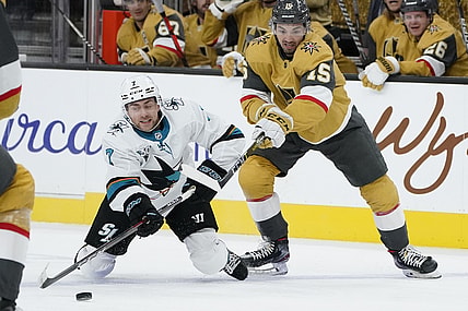 Apr 21, 2021; Las Vegas, Nevada, USA; San Jose Sharks center Dylan Gambrell (7) and Vegas Golden Knights  Dylan Sikura vie for the puck during the first period of an NHL hockey game at T-Mobile Arena. Mandatory Credit:  POOL PHOTOS-USA TODAY Sports