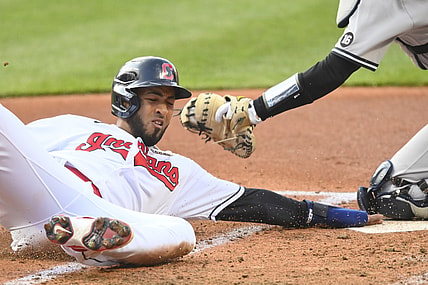 Apr 22, 2021; Cleveland, Ohio, USA; Cleveland Indians left fielder Eddie Rosario (9) scores in the first inning against the New York Yankees at Progressive Field. Mandatory Credit: David Richard-USA TODAY Sports