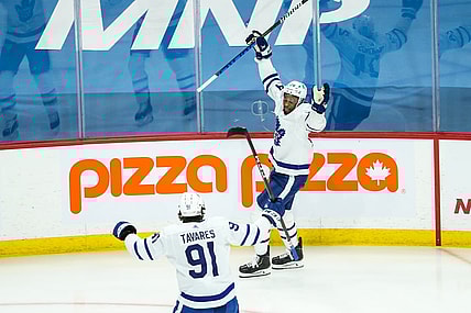 Apr 22, 2021; Winnipeg, Manitoba, CAN;  Toronto Maple Leafs forward Wayne Simmonds (24) celebrates his goal against the Winnipeg Jets during the first period at Bell MTS Place. Mandatory Credit: Terrence Lee-USA TODAY Sports