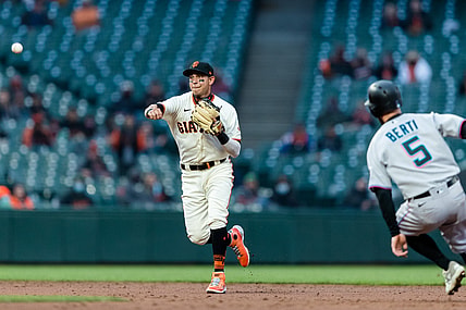 Apr 22, 2021; San Francisco, California, USA;  San Francisco Giants shortstop Mauricio Dubon (1) throws to first base for a double play against Miami Marlins in the second inning at Oracle Park. Mandatory Credit: John Hefti-USA TODAY Sports