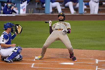 Apr 22, 2021; Los Angeles, California, USA; San Diego Padres shortstop Fernando Tatis Jr. (23) leans to avoid a pitch as Los Angeles Dodgers catcher Will Smith (16) watches in the first inning at Dodger Stadium. Mandatory Credit: Kirby Lee-USA TODAY Sports