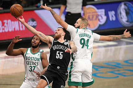 Apr 23, 2021; Brooklyn, New York, USA; Brooklyn Nets forward Mike James (55) drives to the basket against Boston Celtics power forward Semi Ojeleye (37) and shooting guard Evan Fournier (94) during the third quarter at Barclays Center. Mandatory Credit: Brad Penner-USA TODAY Sports