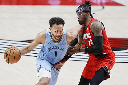 Apr 23, 2021; Portland, Oregon, USA; Memphis Grizzlies small forward Kyle Anderson (1) dribbles the ball as Portland Trail Blazers power forward Robert Covington (23) defends during the second half at Moda Center. Mandatory Credit: Soobum Im-USA TODAY Sports